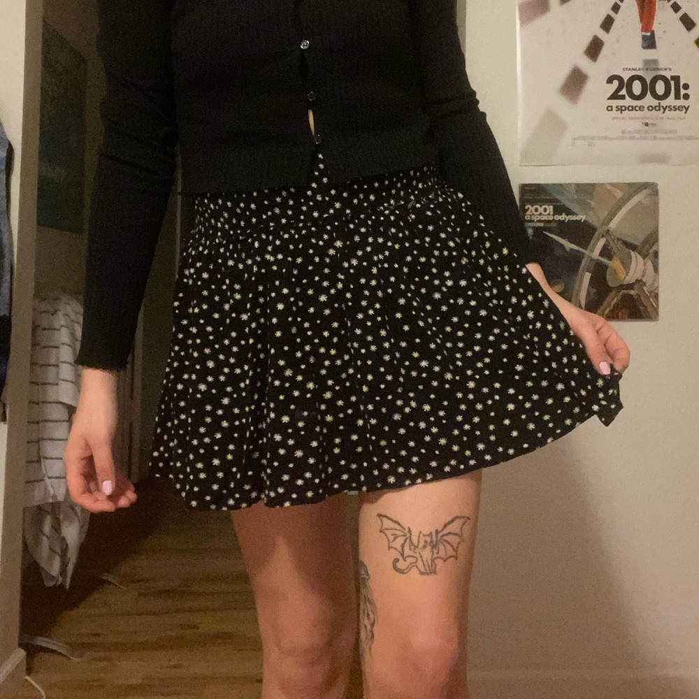 Black skirt w/ yellow and white flowers